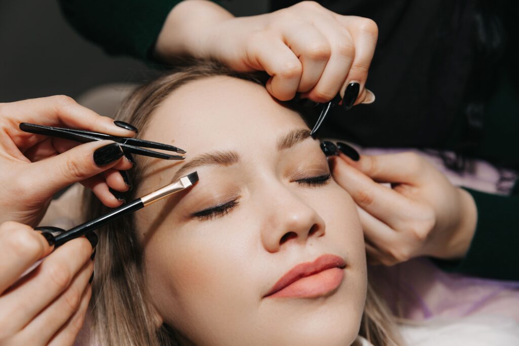 girl-makes-eyebrow-styling-in-a-beauty-salon-the-2023-11-27-05-21-51-utc-min